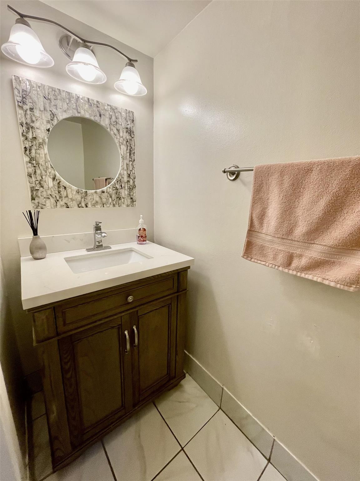 9787 Riverside Drive, Unit 624 Coral Springs, FL 33071 - Photo 17 of 21 a bathroom with a sink vanity and a mirror
