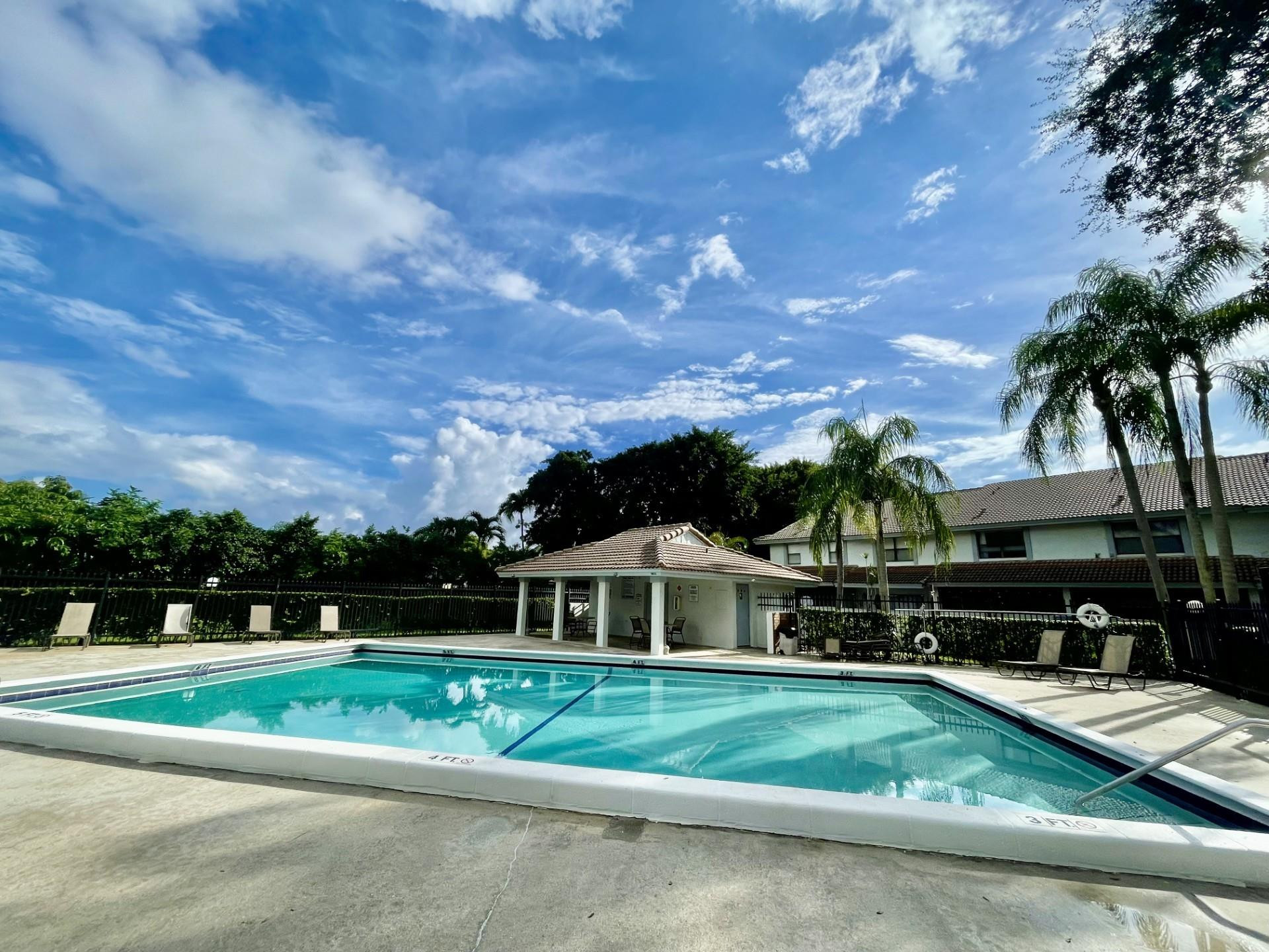 9787 Riverside Drive, Unit 624 Coral Springs, FL 33071 - Photo 21 of 21 a front view of a house with a yard