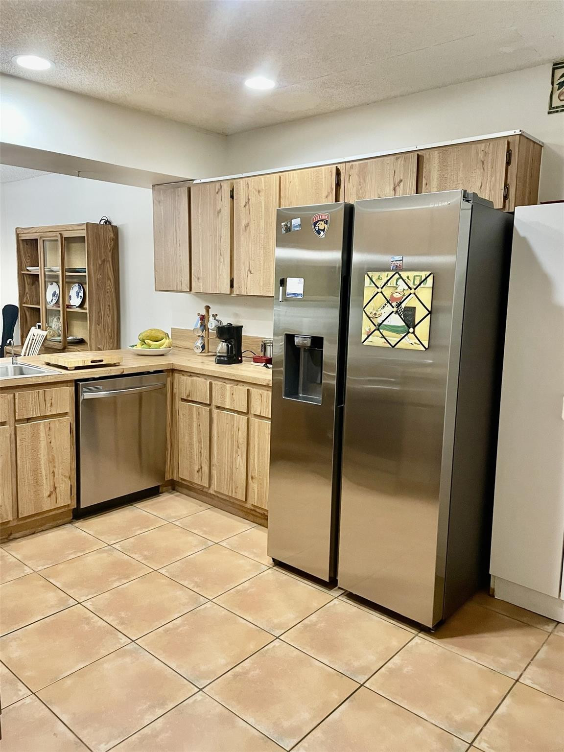 9787 Riverside Drive, Unit 624 Coral Springs, FL 33071 - Photo 6 of 21 a kitchen with stainless steel appliances granite countertop a refrigerator and a sink