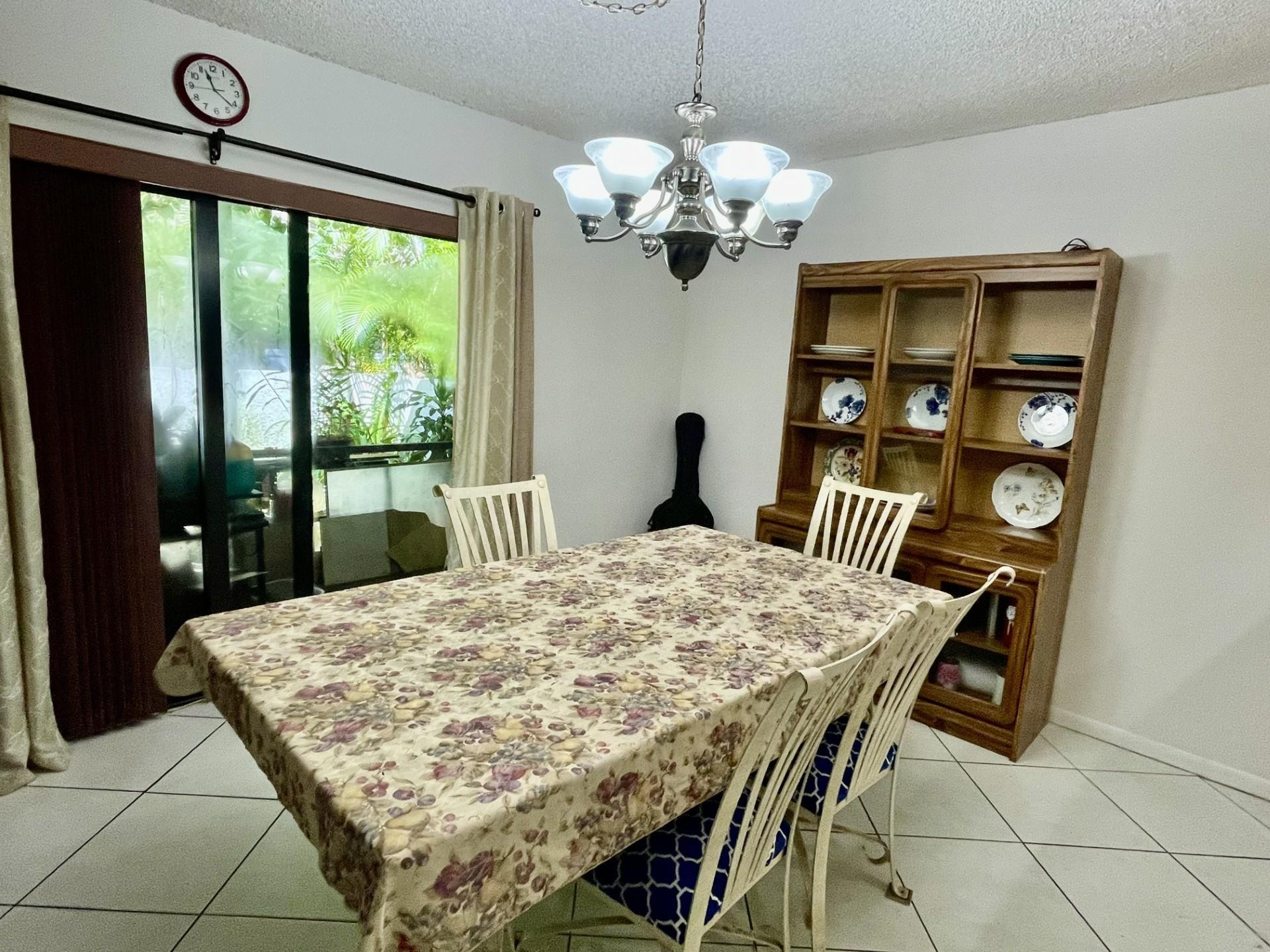 9787 Riverside Drive, Unit 624 Coral Springs, FL 33071 - Photo 8 of 21 a dining room with furniture and window
