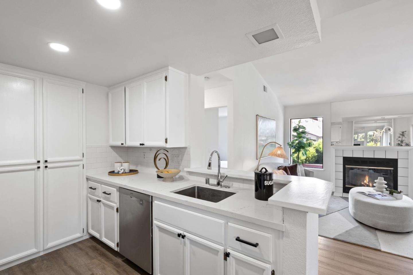 38872 Cherry Glen Common Fremont, CA 94536 - Photo 13 of 22 a kitchen with a sink cabinets and living room