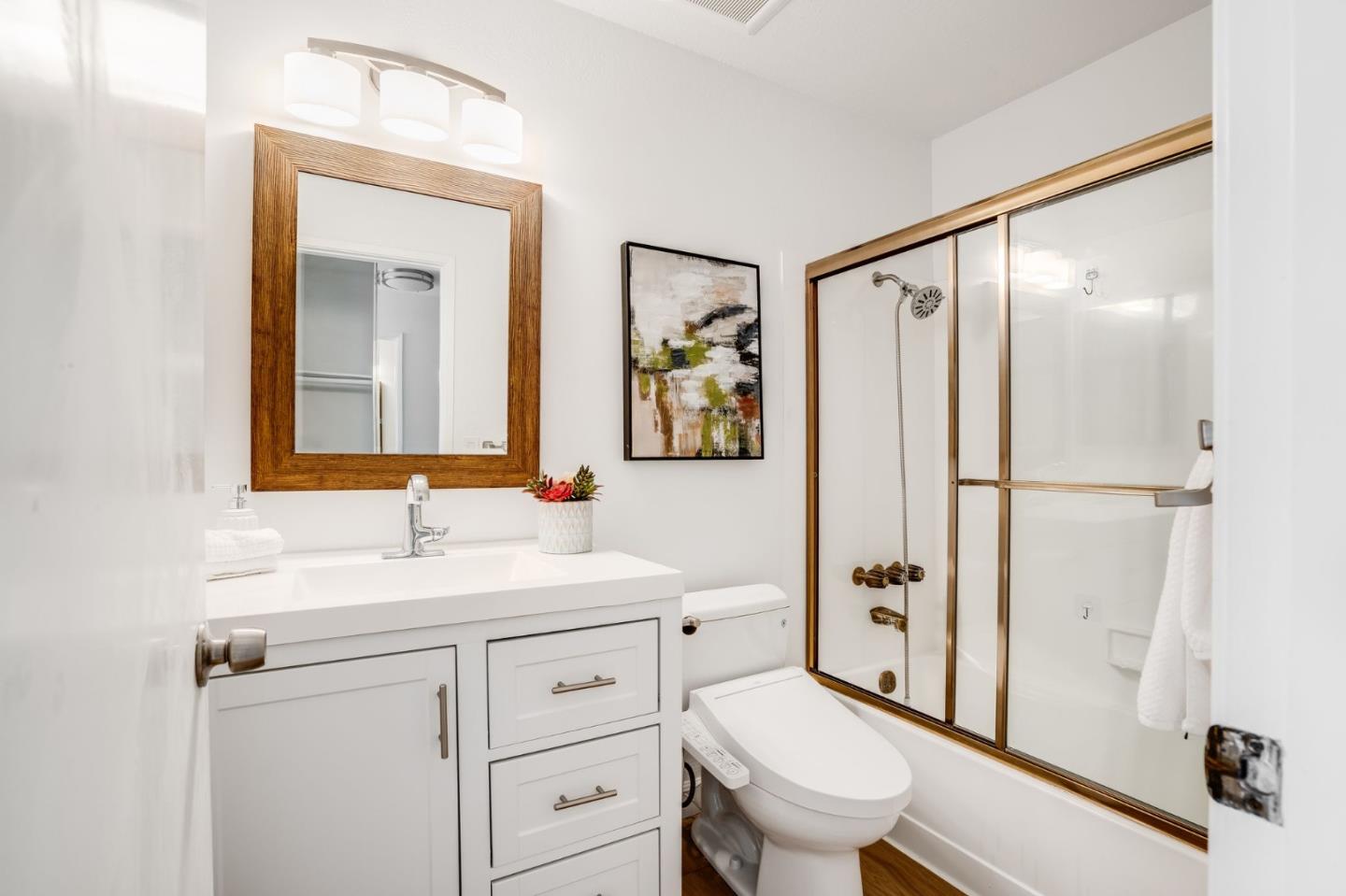38872 Cherry Glen Common Fremont, CA 94536 - Photo 17 of 22 a bathroom with a sink toilet vanity and shower