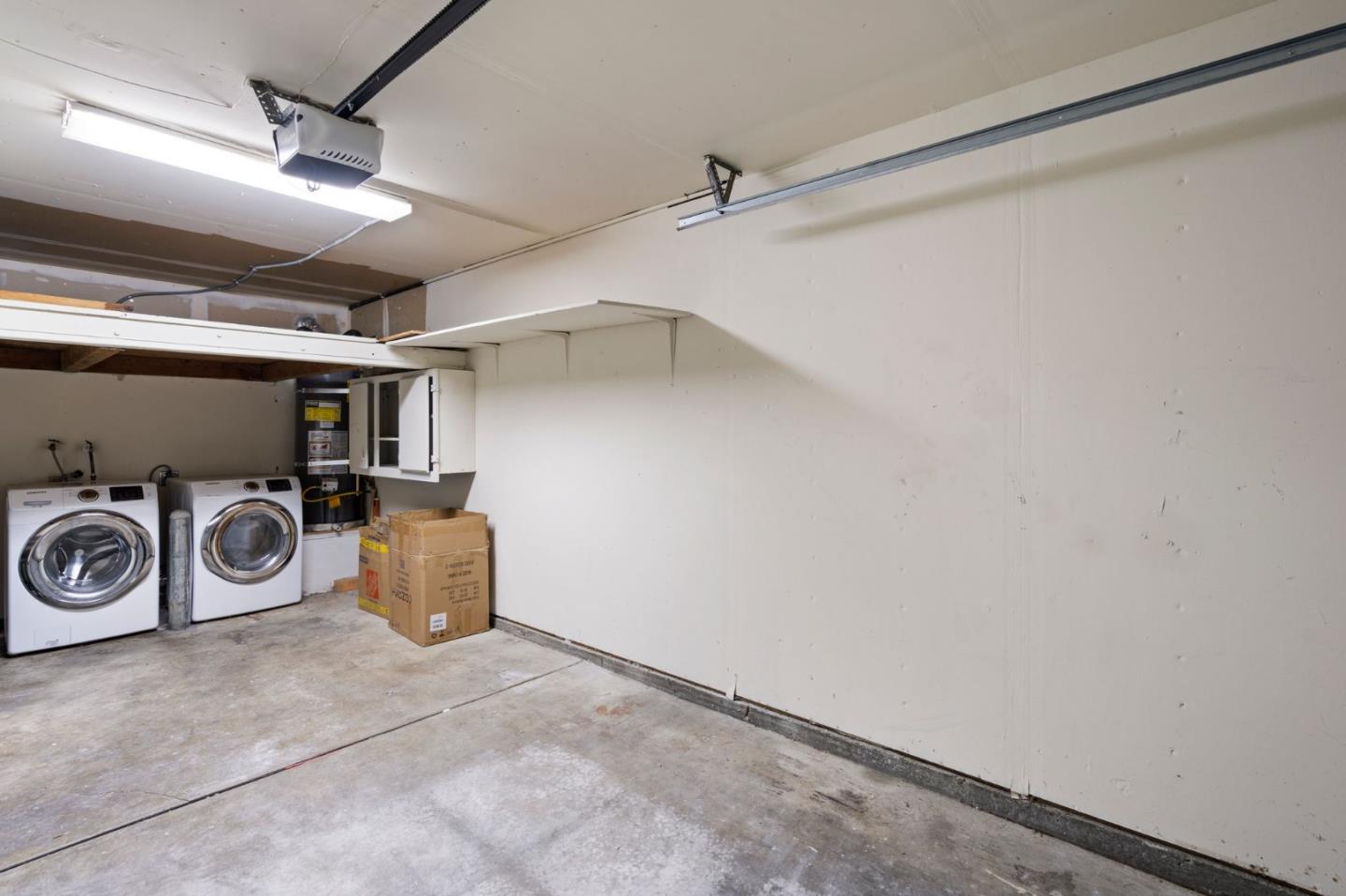 38872 Cherry Glen Common Fremont, CA 94536 - Photo 19 of 22 a view of a storage & utility room with washer and dryer