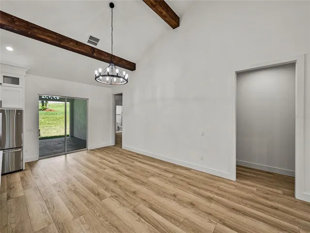 a bathroom with a double vanity sink a large mirror a shower and bathtub