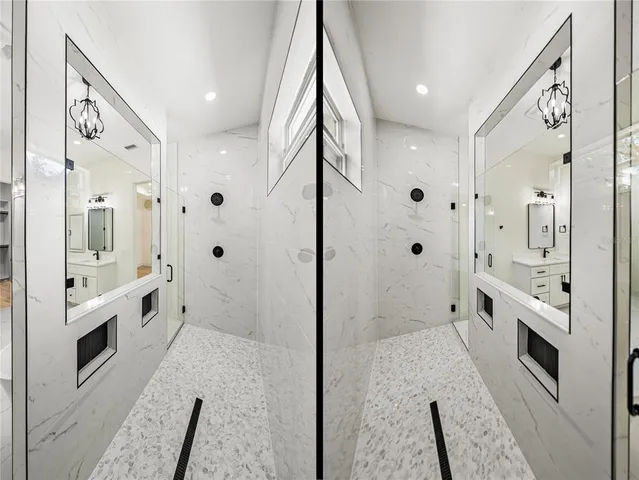 a view of an empty room with a window and a ceiling fan