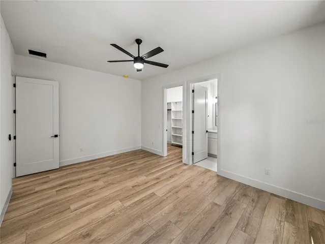 a bathroom with double sink and two mirror