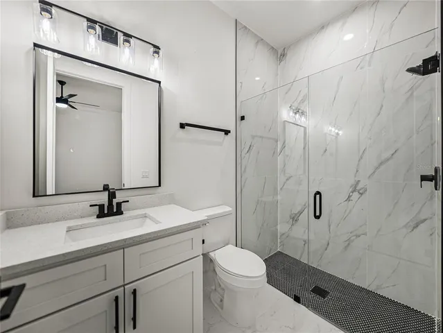 a bathroom with a double vanity sink mirror and double