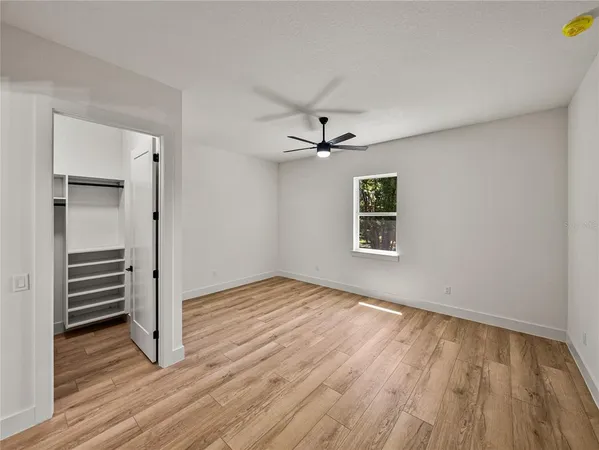 a spacious bathroom with a double vanity sink and mirror