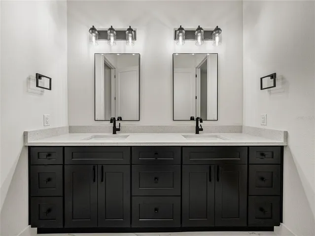 an empty room with a window and a ceiling fan