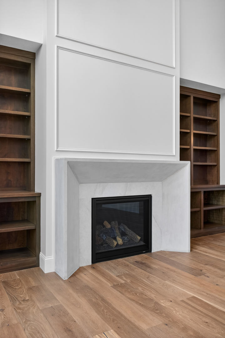6928 Wilderness Pointe Bettendorf, IA 52722 - Photo 13 of 48 a view of an empty room with a fireplace and a window