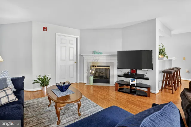 a living room with furniture fireplace and flat screen tv