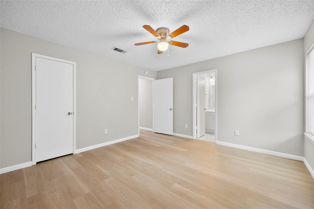 6219 Kelly Elliott Road Arlington, TX 76001 - Photo 11 of 17 Primary bedroom with ensuite bathroom