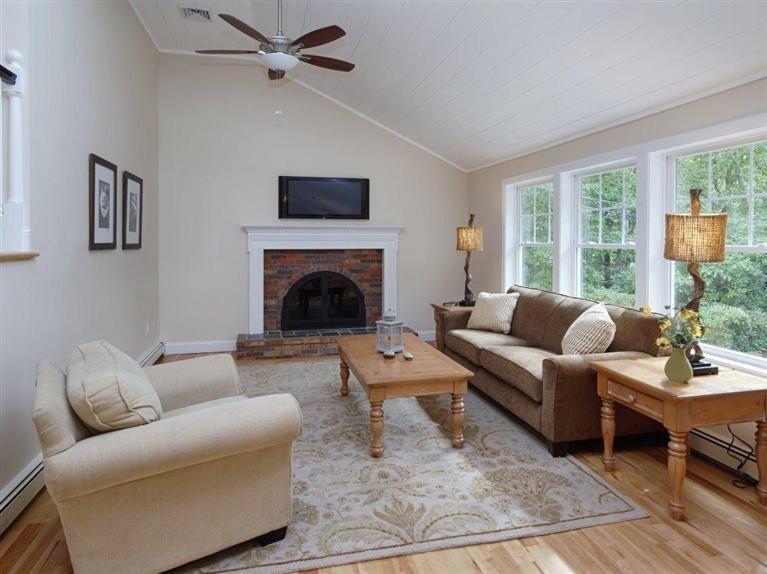 537 Scraggy Neck Road Cataumet, MA 02534 - Photo 12 of 33 a living room with furniture and a fireplace