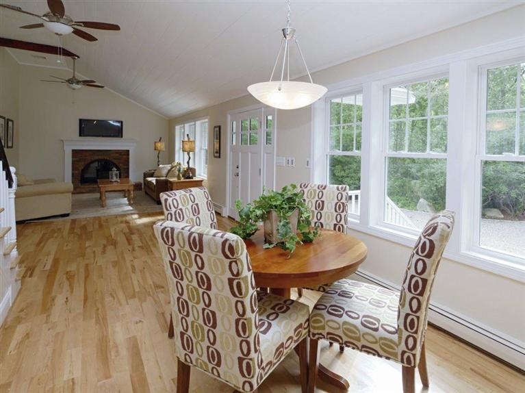 537 Scraggy Neck Road Cataumet, MA 02534 - Photo 13 of 33 a view of a dining room with furniture window and wooden floor