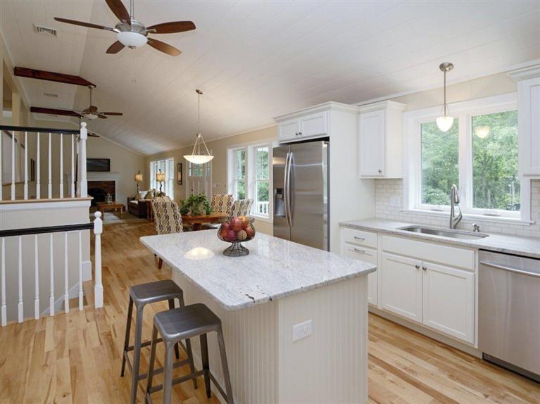 537 Scraggy Neck Road Cataumet, MA 02534 - Photo 15 of 33 a kitchen with sink cabinets and wooden floor