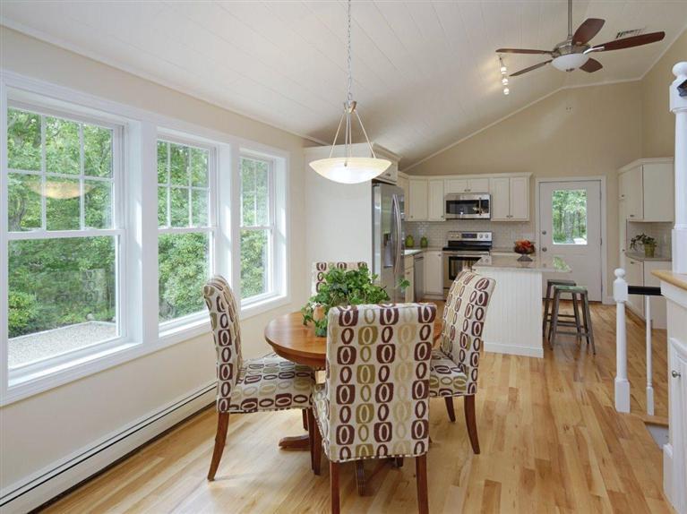 537 Scraggy Neck Road Cataumet, MA 02534 - Photo 17 of 33 a view of a dining room with furniture window and wooden floor