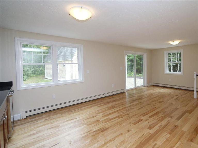 537 Scraggy Neck Road Cataumet, MA 02534 - Photo 20 of 33 a view of an empty room with wooden floor and a window