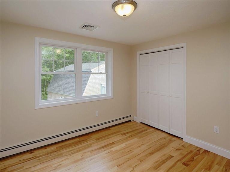 537 Scraggy Neck Road Cataumet, MA 02534 - Photo 26 of 33 a view of empty room with wooden floor and fan