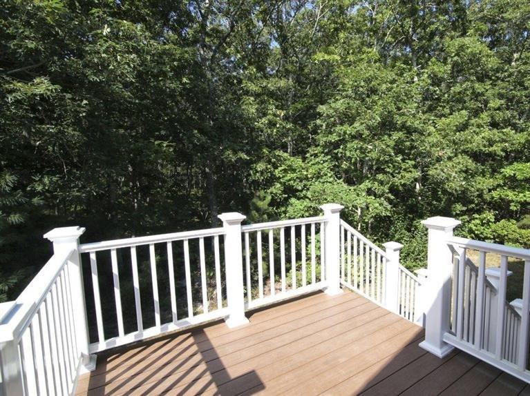 537 Scraggy Neck Road Cataumet, MA 02534 - Photo 30 of 33 a balcony with wooden floor and fence