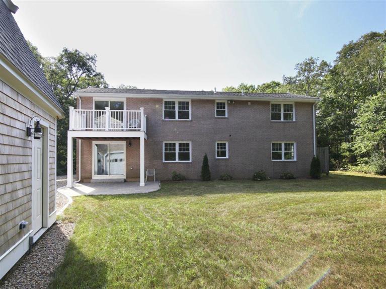 537 Scraggy Neck Road Cataumet, MA 02534 - Photo 32 of 33 a view of a house with a yard