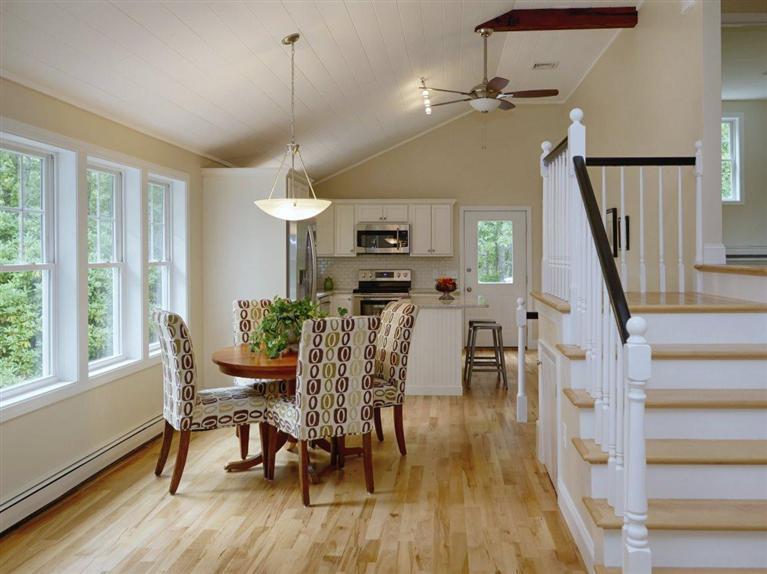 537 Scraggy Neck Road Cataumet, MA 02534 - Photo 10 of 33 a view of a dining room with furniture window and wooden floor
