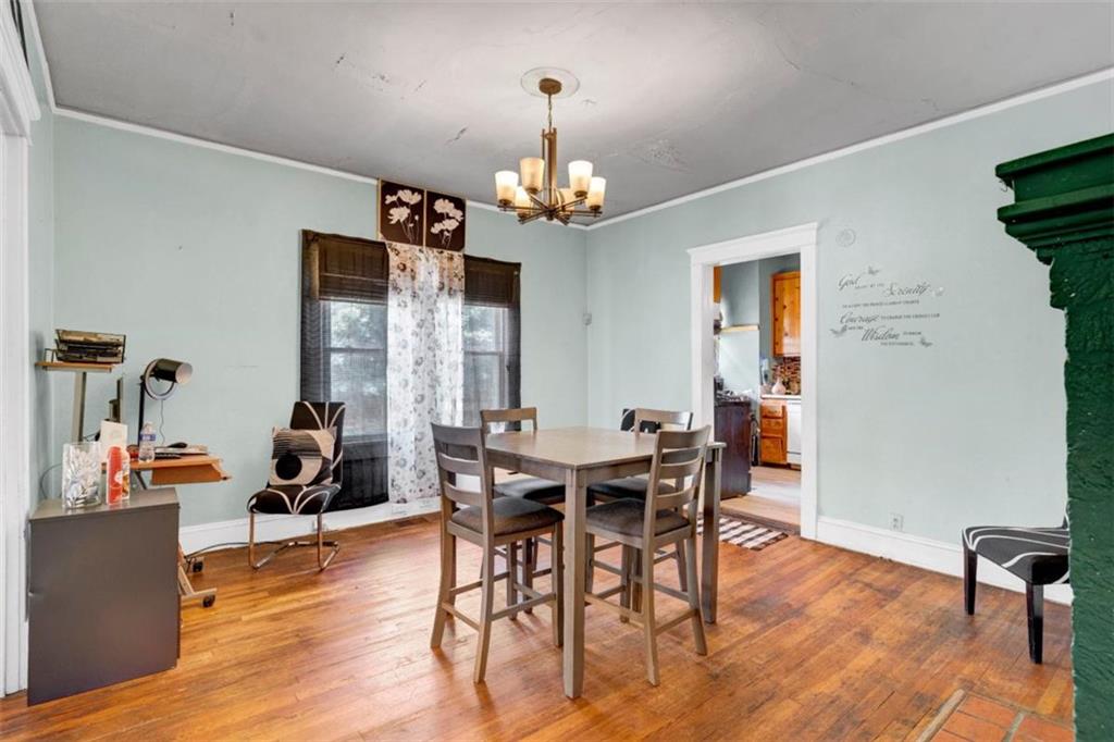 943 Washington Place Southwest Atlanta, GA 30314 - Photo 4 of 25 a view of a dining room with furniture window and wooden floor