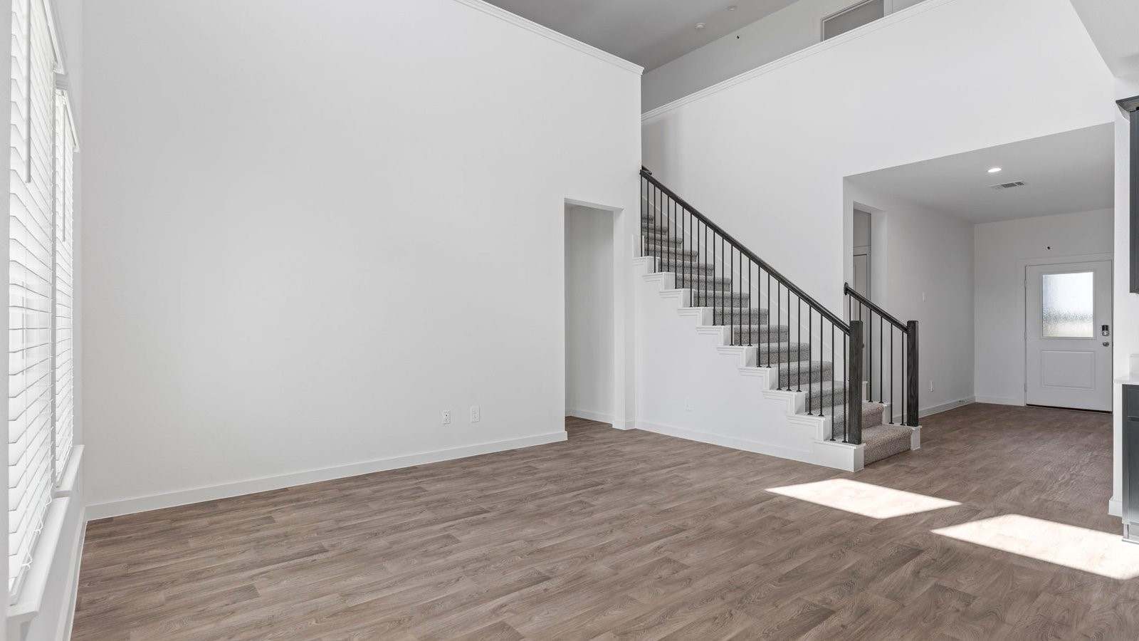 6216 Orchid Crst Lane Rosenberg, TX 77469 - Photo 13 of 48 a view of entryway and hall with wooden floor