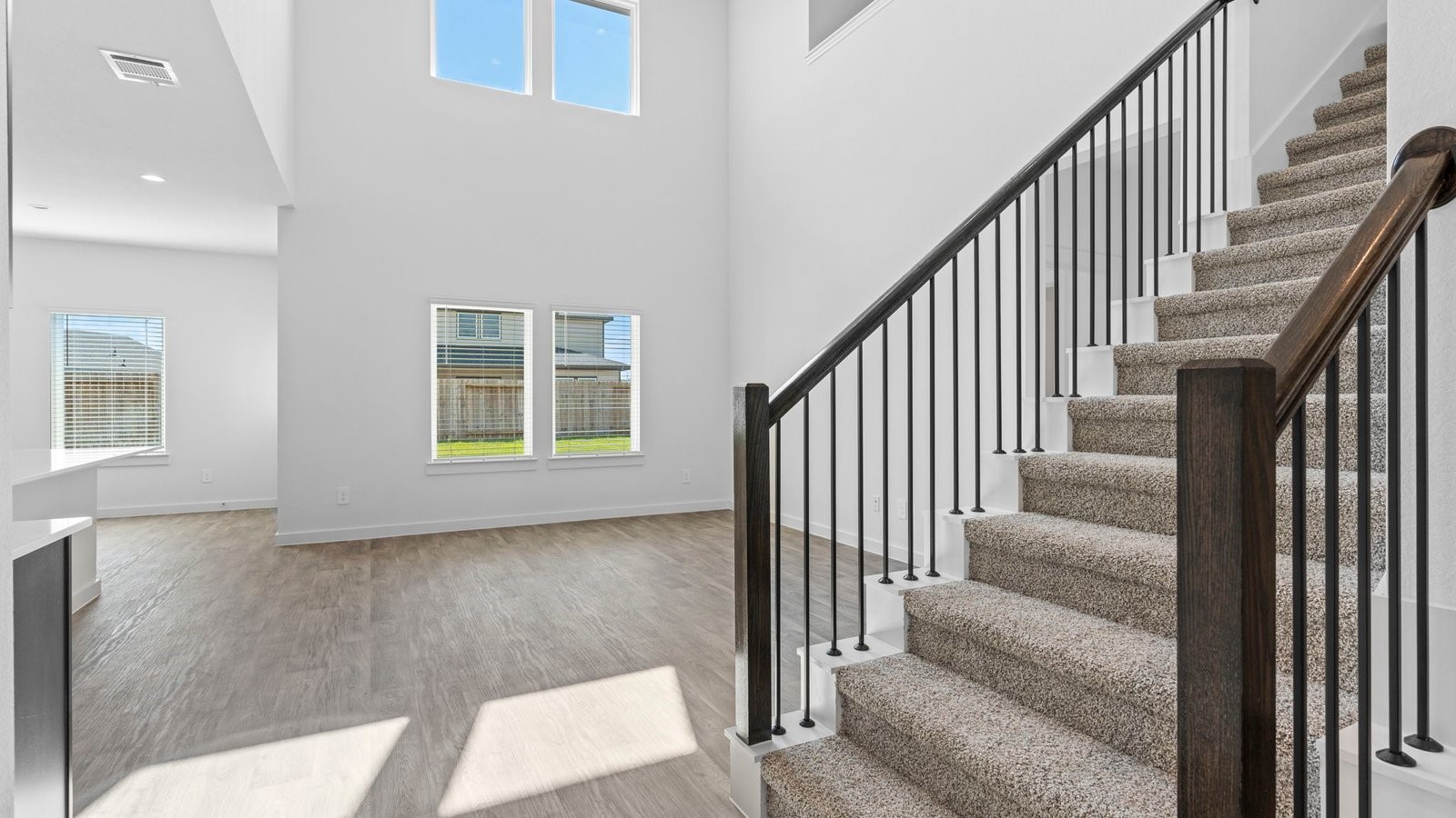 6216 Orchid Crst Lane Rosenberg, TX 77469 - Photo 23 of 48 a view of staircase with lots of frames and couches