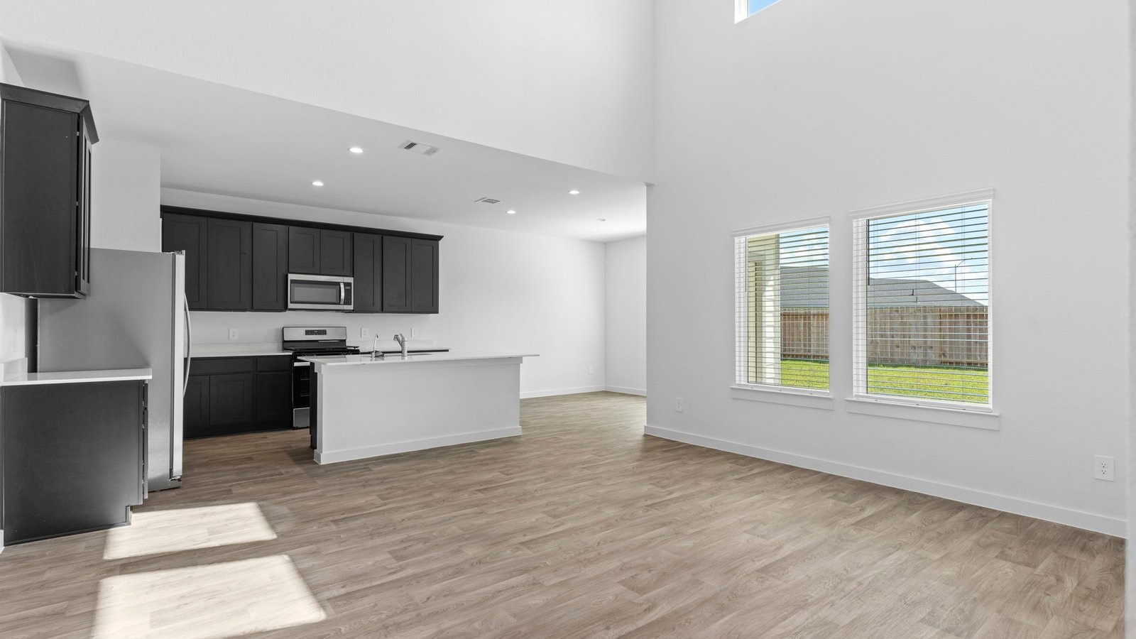 6216 Orchid Crst Lane Rosenberg, TX 77469 - Photo 7 of 48 a large kitchen with a large window and a counter top space