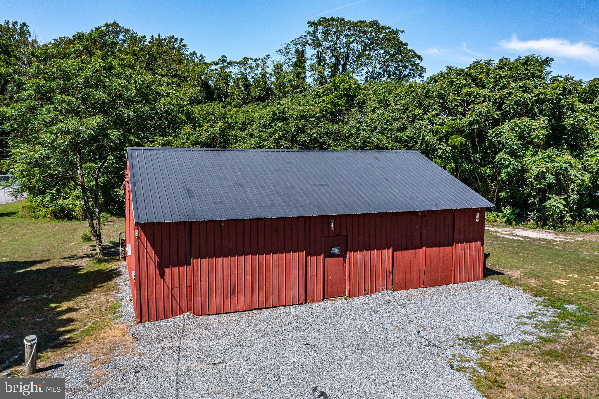 9832 River Road Lancaster, VA 22503 - Photo 45 of 68 Charming red barn nestled in nature.