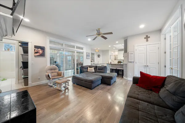 a living room with furniture a fireplace and a flat screen tv