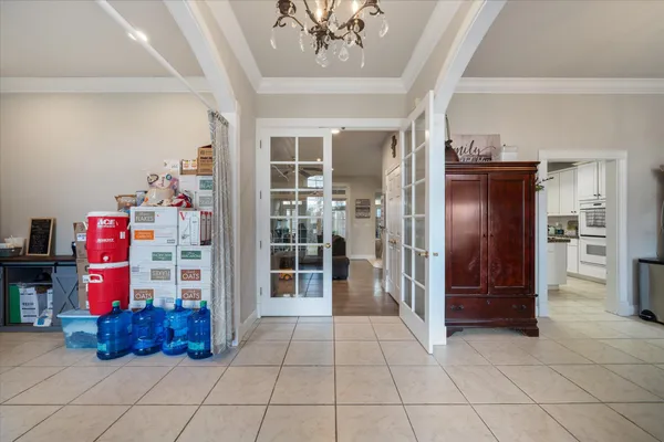 a large bathroom with a double vanity sink a large mirror and a bathtub