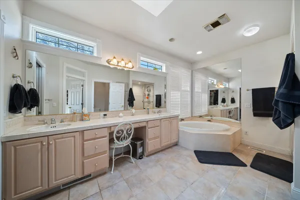 a bathroom with a sink a mirror and a shower