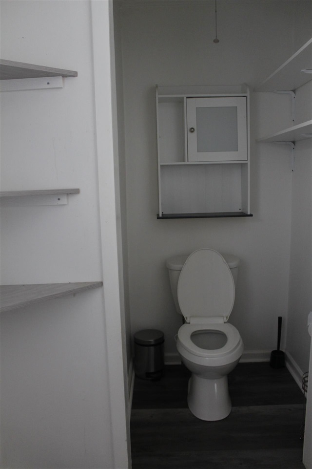 985 Little John Road Memphis, TN 38111 - Photo 11 of 24 a white toilet sitting next to a sink