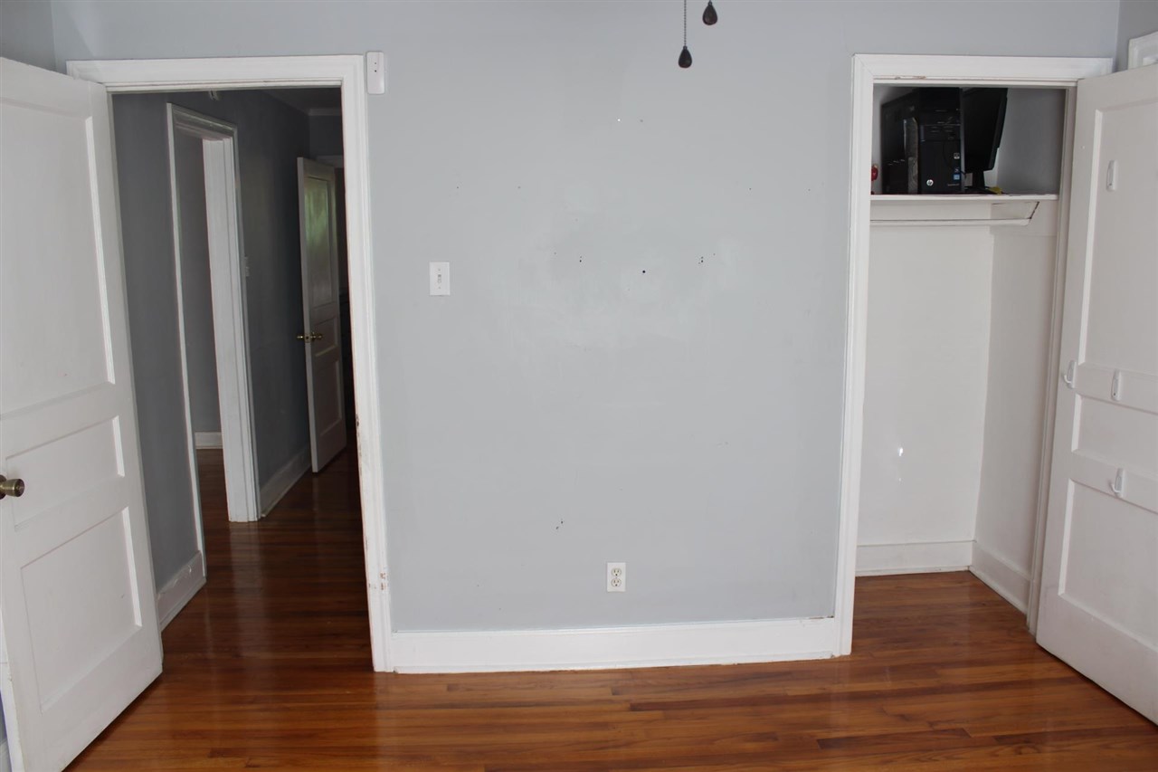 985 Little John Road Memphis, TN 38111 - Photo 16 of 24 a view of a hallway with wooden floor