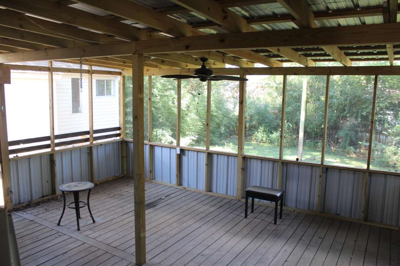 985 Little John Road Memphis, TN 38111 - Photo 20 of 24 a view of a porch with furniture and wooden floor