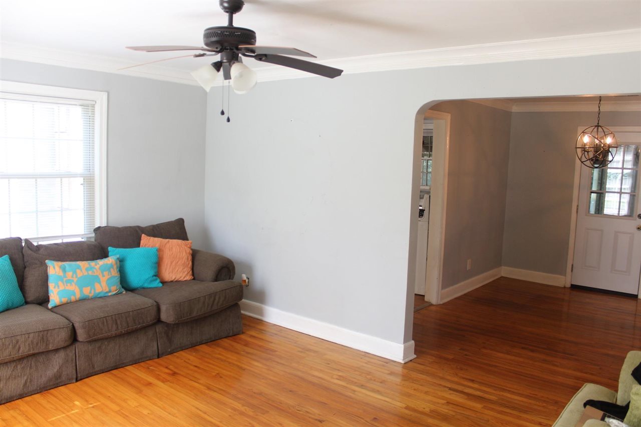 985 Little John Road Memphis, TN 38111 - Photo 3 of 24 a living room with furniture and a wooden floor