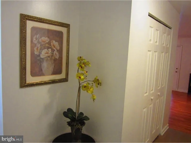 a view of hallway with wooden floor