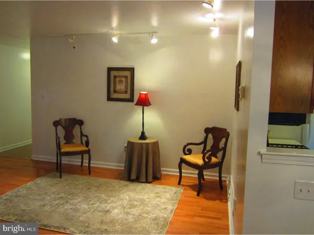 a view of entryway with wooden floor and door