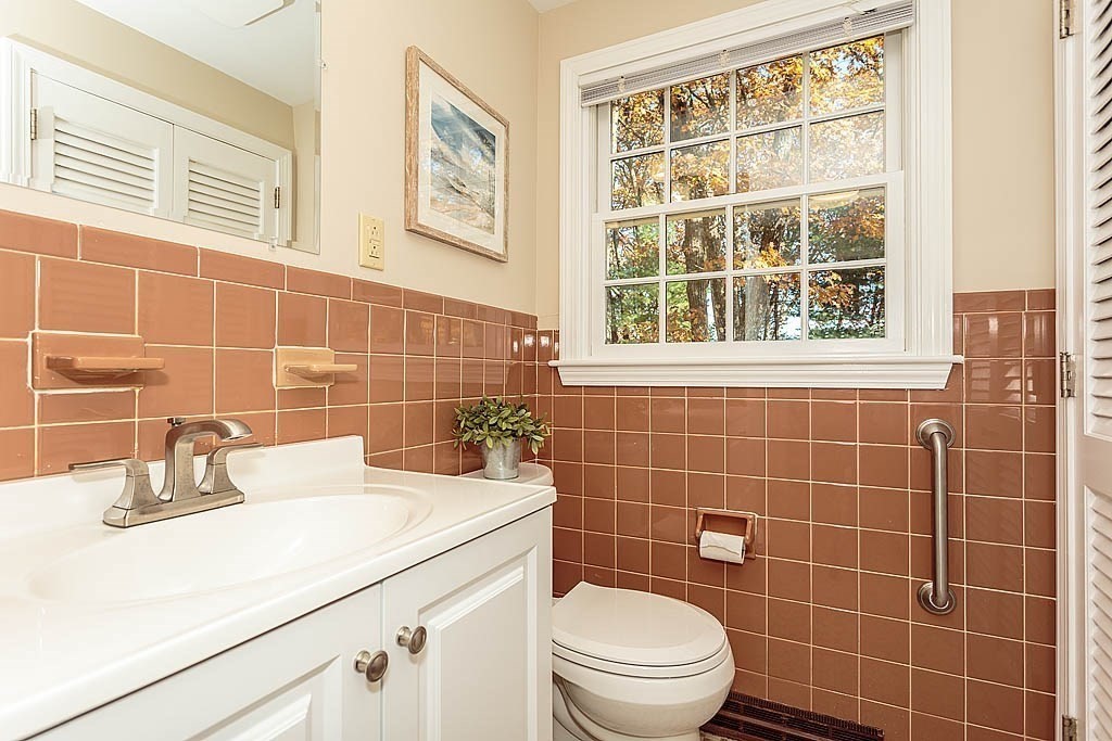 49 Amble Road Chelmsford, MA 01824 - Photo 18 of 26 a bathroom with a sink a toilet and shower