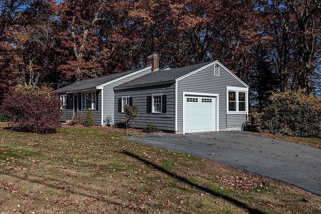 49 Amble Road Chelmsford, MA 01824 - Photo 2 of 26 a front view of a house with a garden