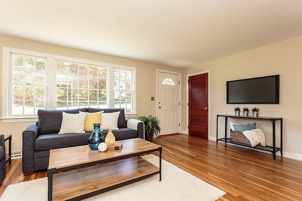 49 Amble Road Chelmsford, MA 01824 - Photo 3 of 26 a living room with furniture and a flat screen tv
