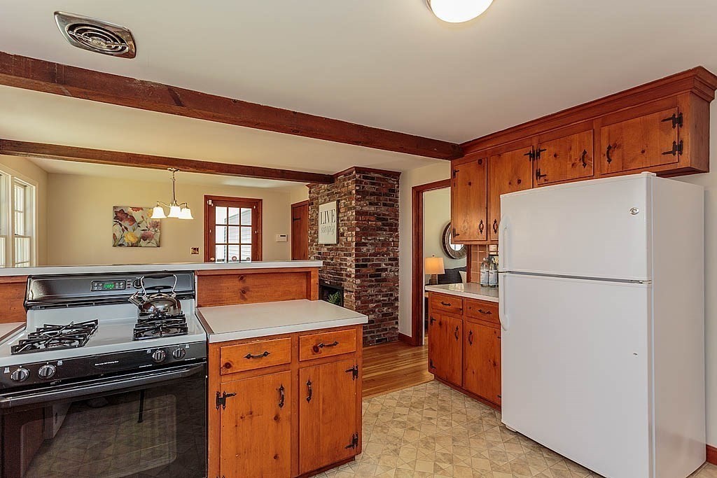 49 Amble Road Chelmsford, MA 01824 - Photo 9 of 26 a kitchen with stainless steel appliances granite countertop a refrigerator stove a sink and dishwasher