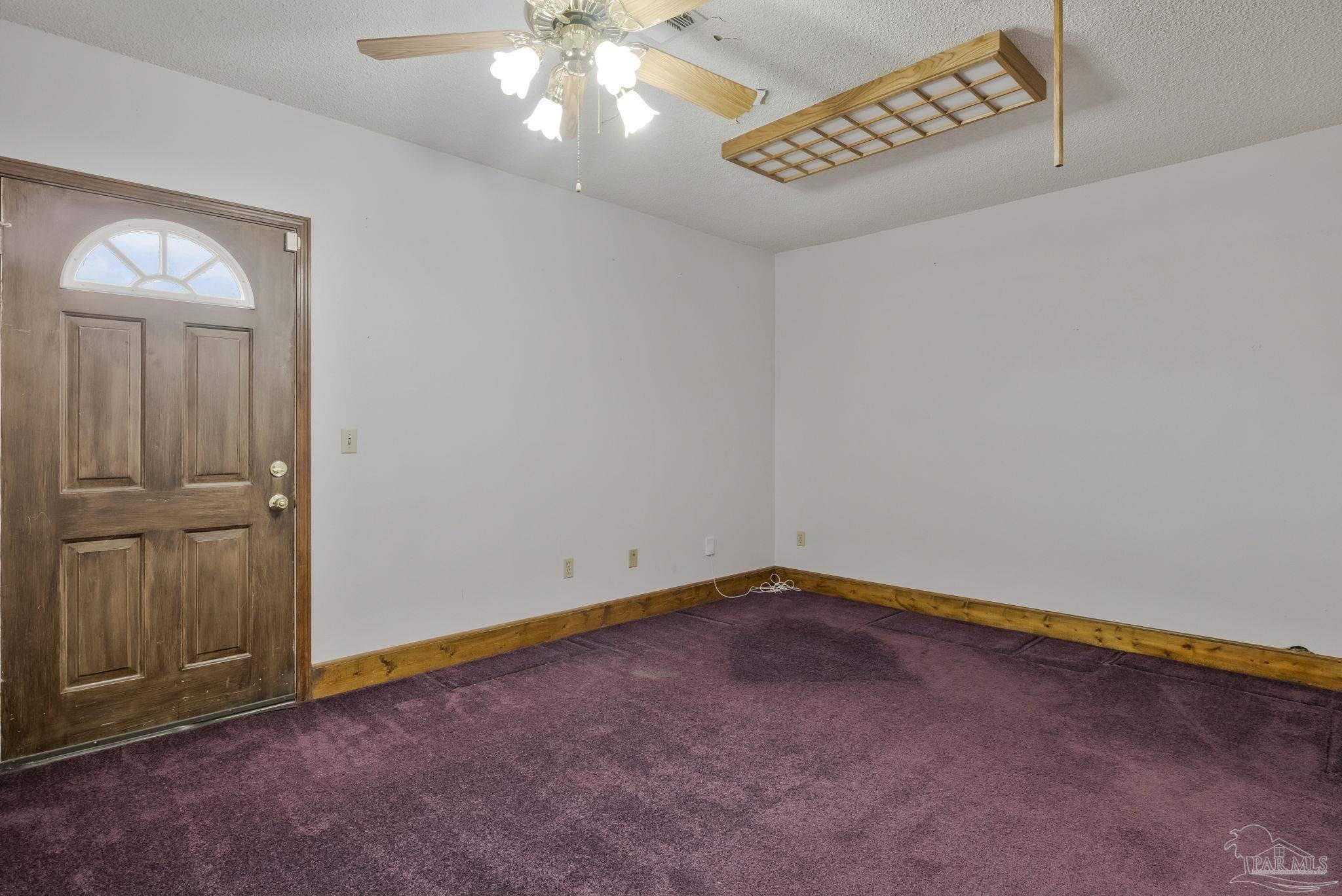 4411 Pace Lane Pace, FL 32571 - Photo 62 of 68 an empty room with a empty space and windows