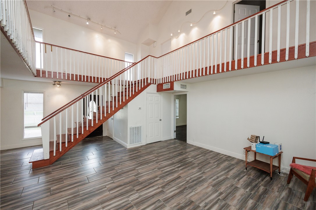 4029 Congressional Drive Corpus Christi, TX 78413 - Photo 13 of 34 a view of a hallway with wooden floor and staircase