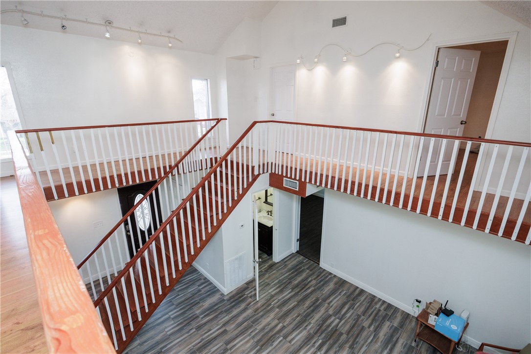 4029 Congressional Drive Corpus Christi, TX 78413 - Photo 14 of 34 a view of hallway with wooden floor and stairs