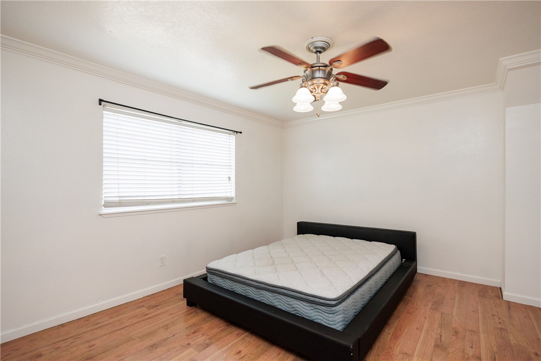 4029 Congressional Drive Corpus Christi, TX 78413 - Photo 17 of 34 a bed sitting in a bedroom next to a window