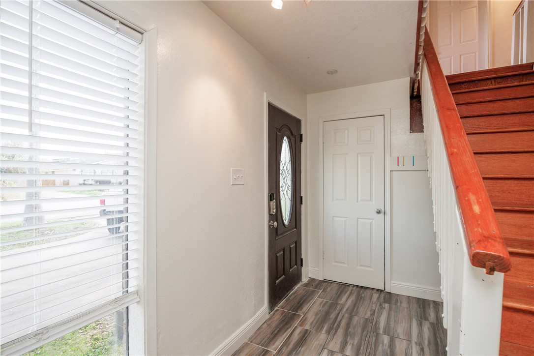 4029 Congressional Drive Corpus Christi, TX 78413 - Photo 25 of 34 a view of hallway with a large window and wooden floor