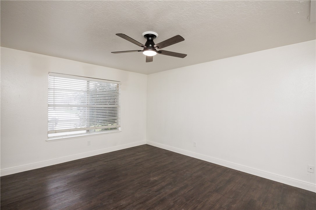 4029 Congressional Drive Corpus Christi, TX 78413 - Photo 28 of 34 a view of an empty room with wooden floor and a window