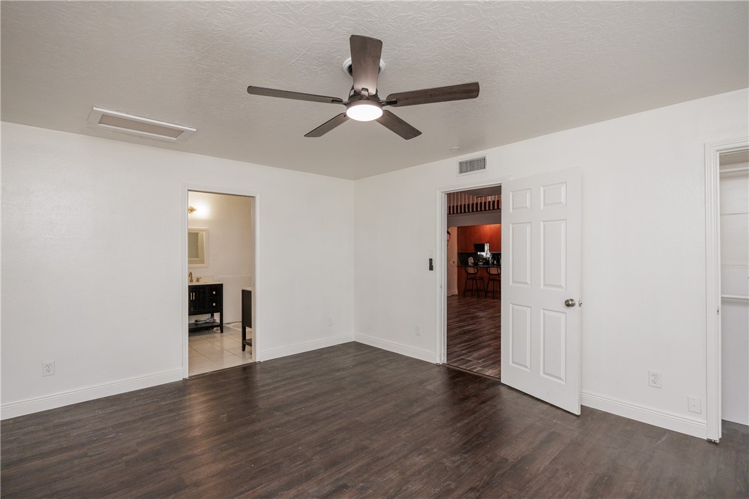 4029 Congressional Drive Corpus Christi, TX 78413 - Photo 30 of 34 an empty room with wooden floor closet and windows
